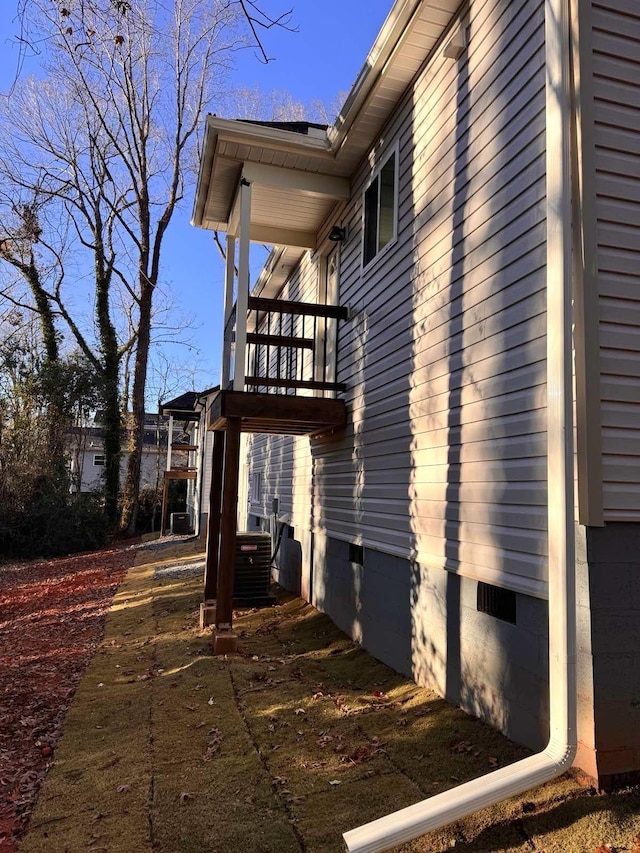 view of side of property with a balcony