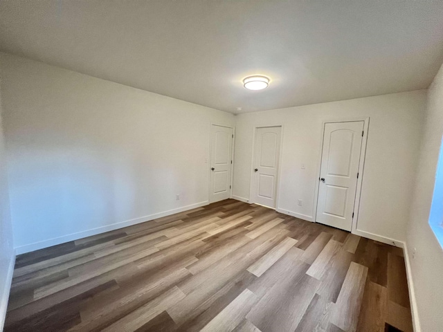 unfurnished bedroom featuring light hardwood / wood-style floors