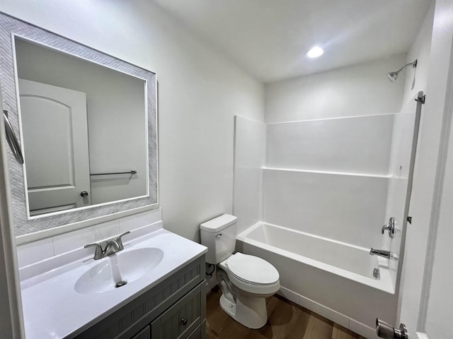 full bathroom featuring vanity, backsplash, hardwood / wood-style flooring, toilet, and shower / bath combination