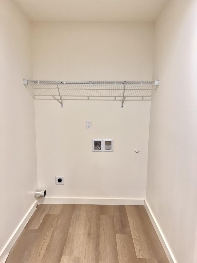 laundry room featuring washer hookup, light hardwood / wood-style floors, and electric dryer hookup