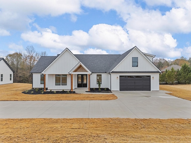 modern inspired farmhouse with a garage and french doors