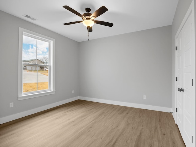 unfurnished bedroom featuring ceiling fan and light hardwood / wood-style flooring