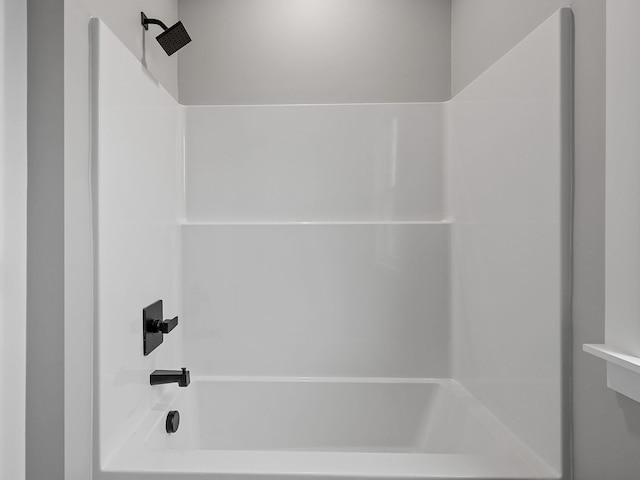 bathroom with shower / washtub combination