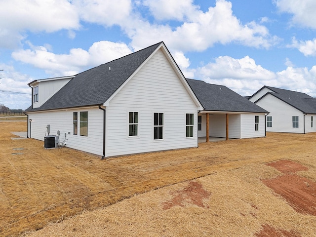 back of house featuring central AC