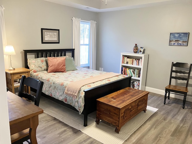 bedroom featuring wood-type flooring