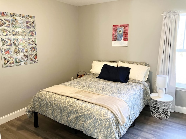 bedroom featuring dark wood-type flooring