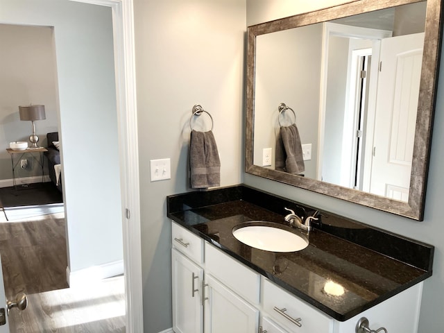 bathroom featuring hardwood / wood-style floors and vanity