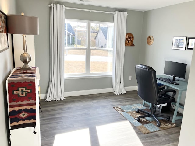 home office with hardwood / wood-style flooring