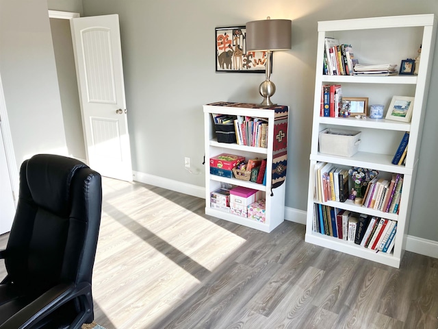 home office with wood-type flooring