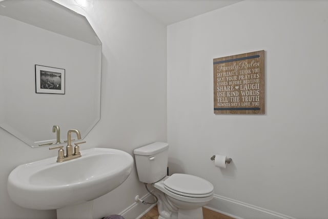 bathroom with toilet and sink