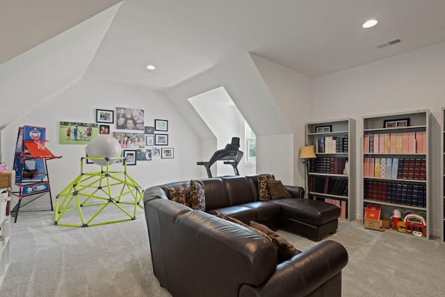 carpeted living room featuring vaulted ceiling