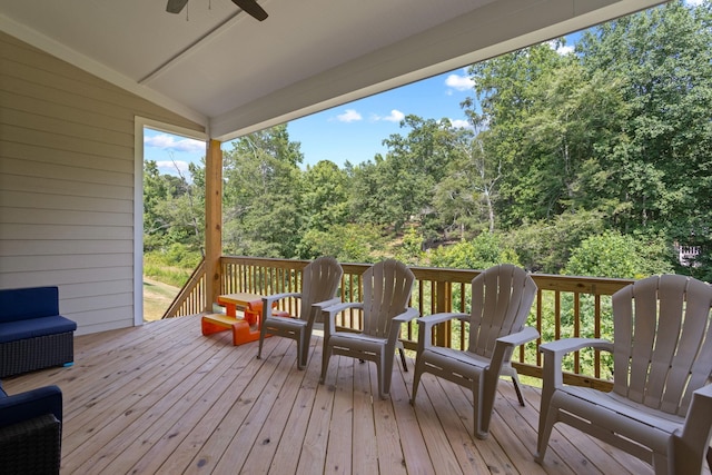 wooden deck featuring ceiling fan