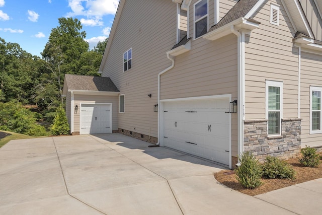 view of side of property with a garage