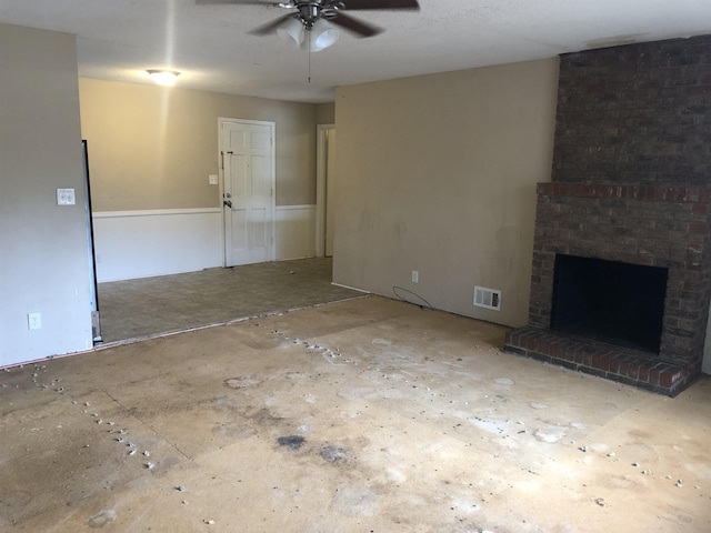 unfurnished living room featuring a fireplace and ceiling fan