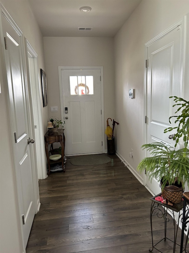 foyer with dark hardwood / wood-style flooring