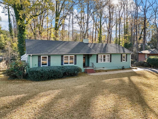 ranch-style home with a front lawn