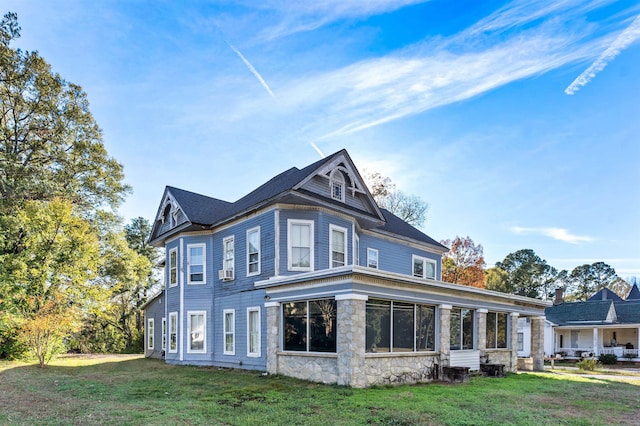 exterior space with a lawn and cooling unit