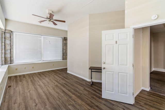 unfurnished room featuring dark hardwood / wood-style floors and ceiling fan