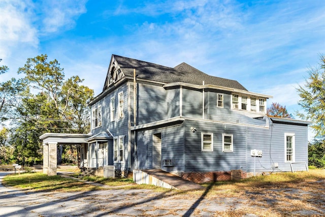 view of property exterior with central AC