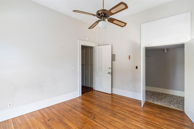 unfurnished room with hardwood / wood-style floors and ceiling fan