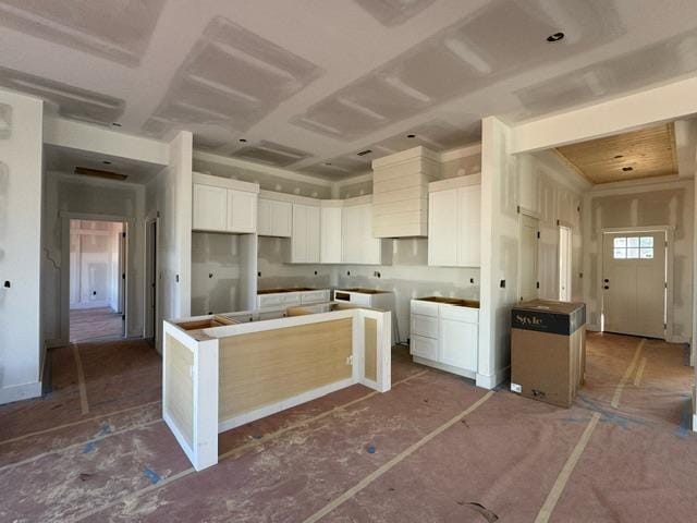 kitchen featuring a center island and white cabinets