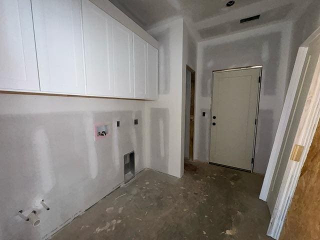 clothes washing area featuring cabinets and washer hookup