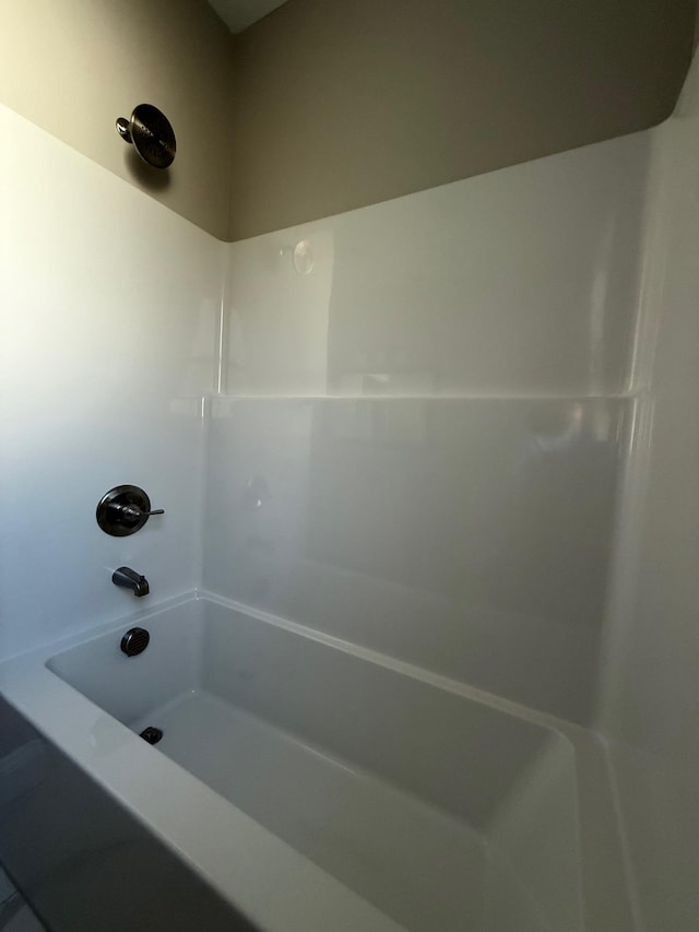 bathroom with shower / washtub combination