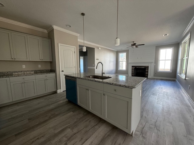 kitchen with sink, gray cabinets, black dishwasher, light stone countertops, and ornamental molding