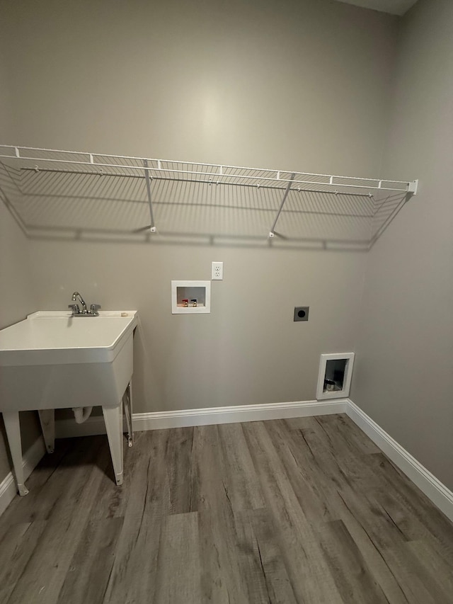 washroom featuring hookup for a washing machine, wood-type flooring, and electric dryer hookup