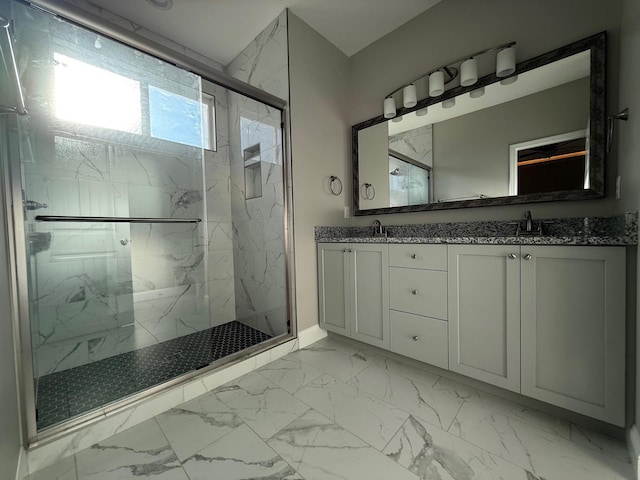 bathroom with vanity and a shower with shower door