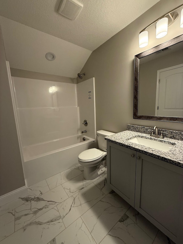 full bathroom with vaulted ceiling, vanity,  shower combination, toilet, and a textured ceiling