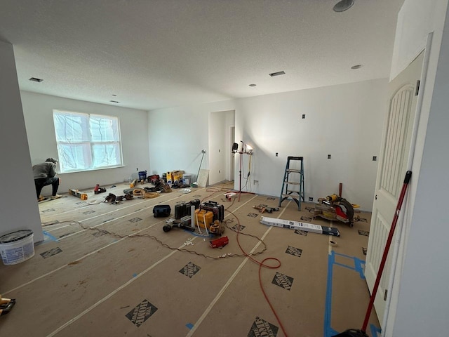 misc room with a textured ceiling