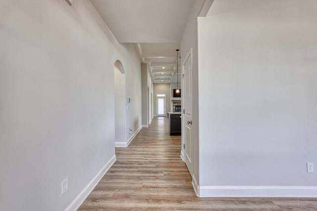 hall with light hardwood / wood-style floors