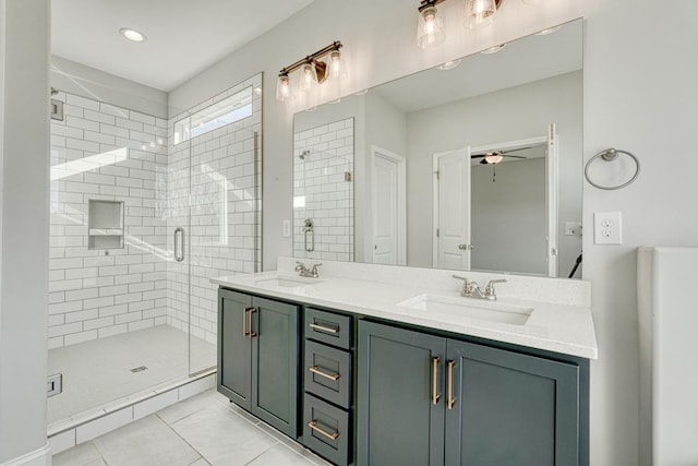 bathroom with an enclosed shower, vanity, tile patterned flooring, and ceiling fan