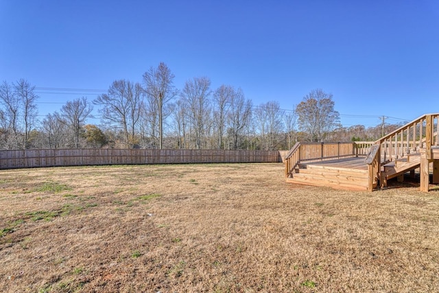 view of yard with a wooden deck