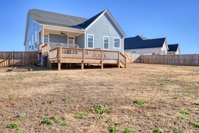 rear view of house featuring a wooden deck and ceiling fan