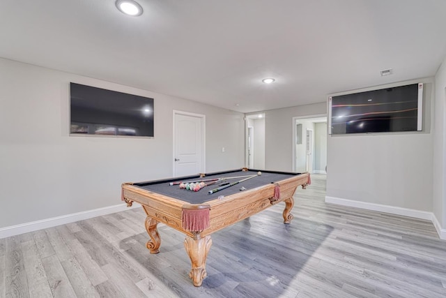 rec room with light hardwood / wood-style floors and billiards