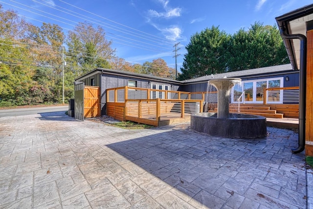 rear view of house with a deck