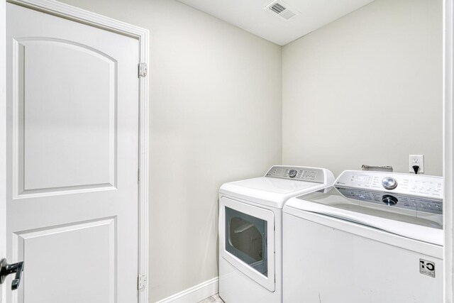 laundry room featuring washing machine and dryer