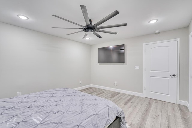 bedroom with light wood-type flooring and ceiling fan