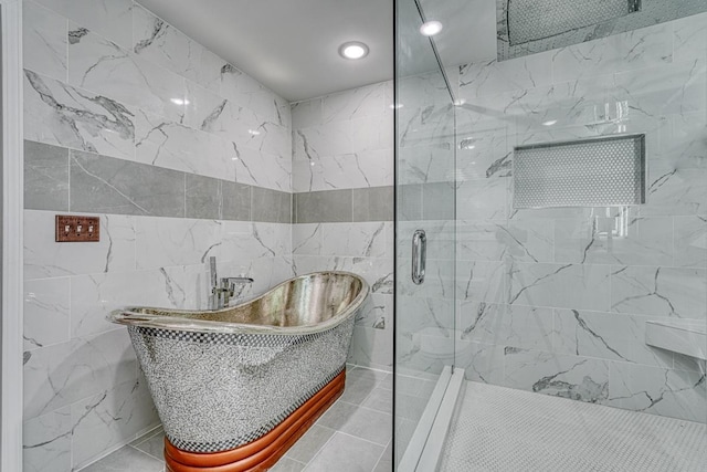 bathroom featuring independent shower and bath and tile walls