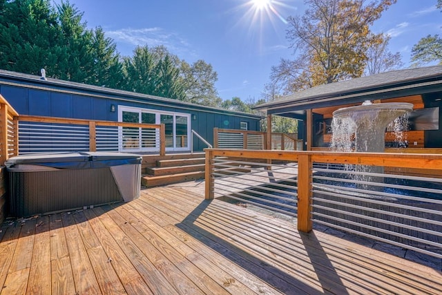 wooden deck with a hot tub