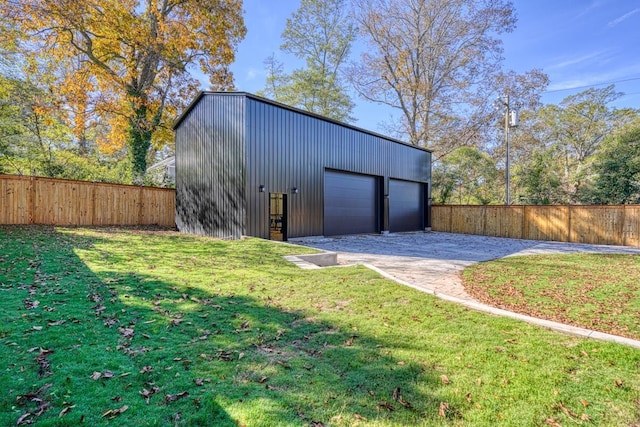 garage featuring a yard