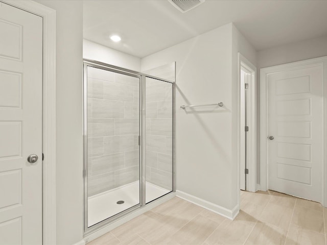 bathroom featuring an enclosed shower