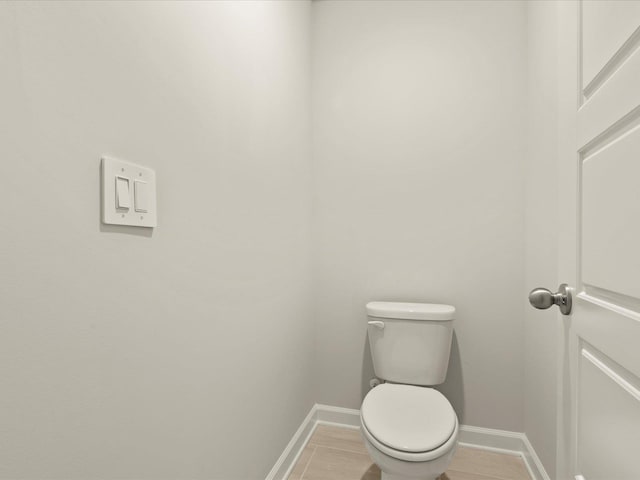 bathroom featuring tile patterned floors and toilet