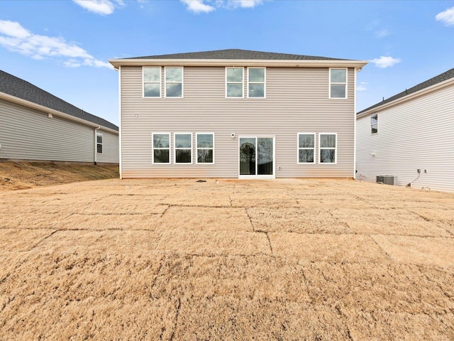 back of house featuring central AC