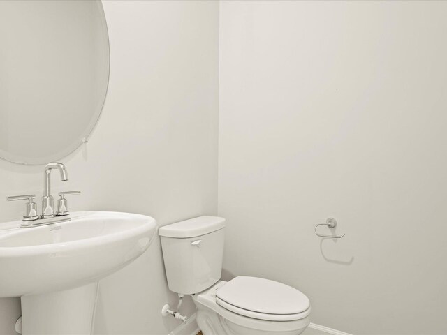 bathroom featuring sink and toilet