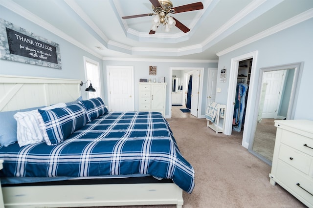 bedroom with ceiling fan, a raised ceiling, ornamental molding, and light carpet