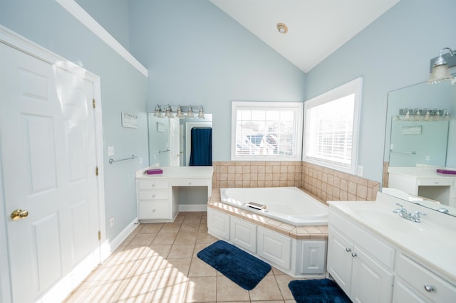 bathroom featuring tile patterned flooring, vanity, high vaulted ceiling, and a bathtub