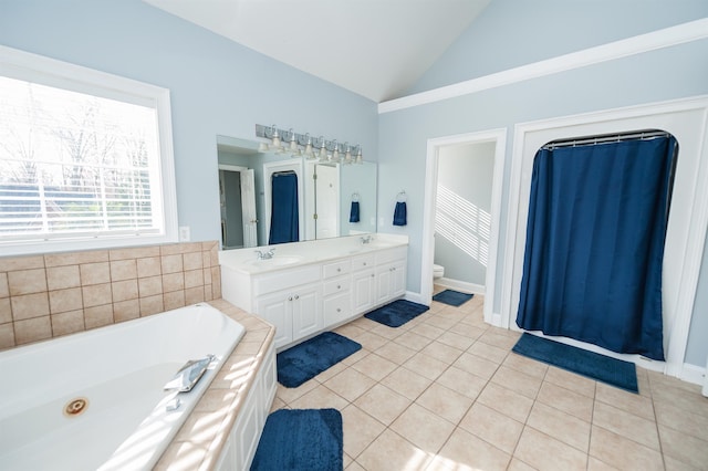 bathroom featuring vanity, tiled tub, tile patterned flooring, toilet, and lofted ceiling